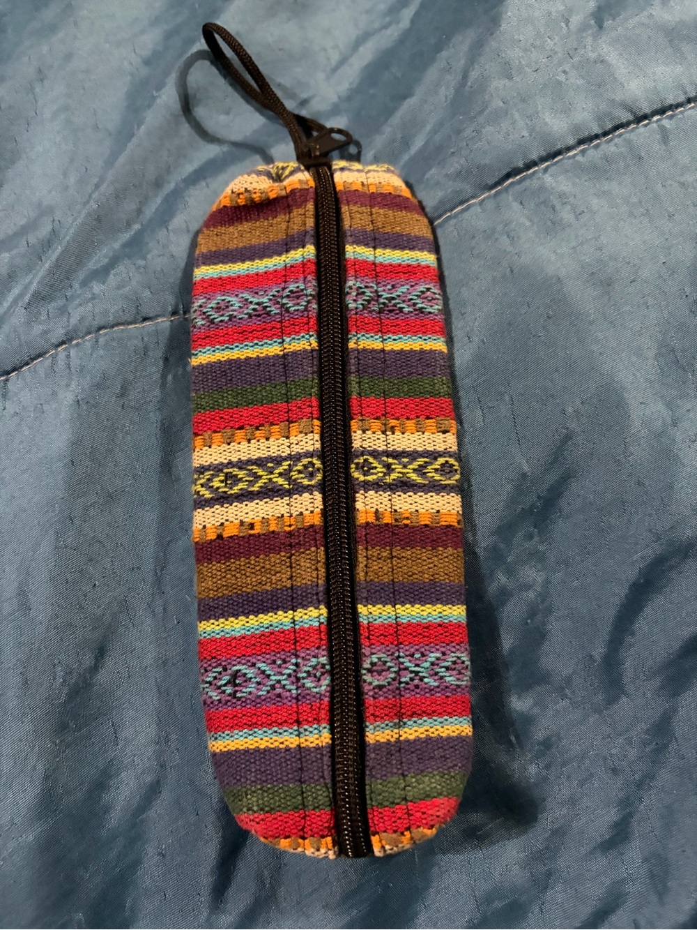 Multicolor Striped Canvas pencil case style travel pouch.